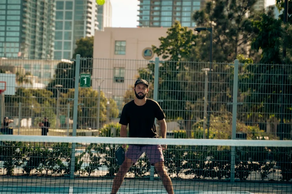 A man standing on a tennis court holding a racquet